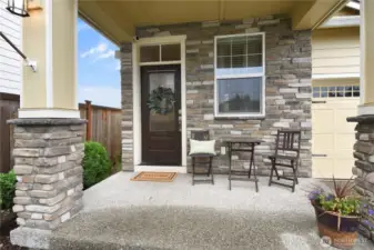Covered front porch welcomes you inside