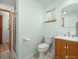 Primary bedroom's bathroom. Updated tile, heated floors.