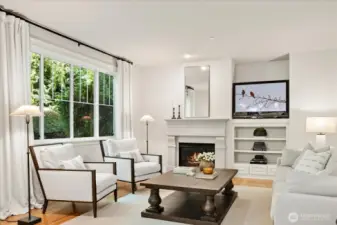 Family Room with backyard green views, and the sound of the soothing backyard waterfall.