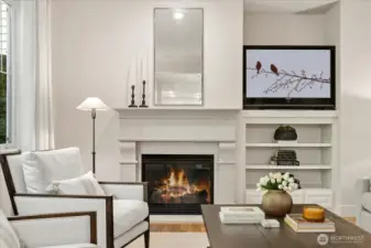 Custom-made Indiana stone fireplace with built-ins and other architectural detailing!