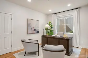 Main-level 5th bedroom or Office option with an adjacent bathroom with shower.