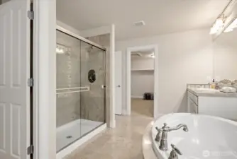 Indulge in a little daily luxury. Wonderful marble tiling with dual shower heads!