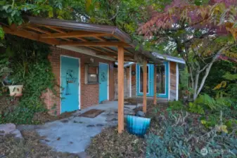 Doors to the left are the original the outhouses for the property have been decommissioned and used as storage.