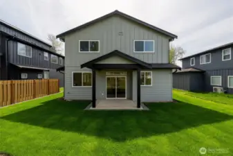 Another view of the back of the home with covered patio.