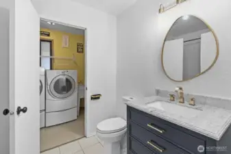 Lower-level full bathroom and laundry room w/d stays with the buyer