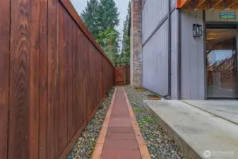 Side view of home with paved walkway