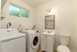 1/2 bath and laundry room on lower floor
