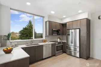 Big picture windows let in light and views of the City and Cascades!