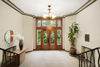 Elegant entry lobby with vintage chandelier is securely monitored.