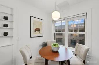 Spacious eating space just off the kitchen, with large courtyard view window