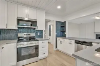 The kitchen features quartz countertops and all new appliances