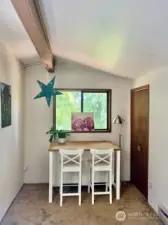 small dining room with adjacent pantry/storage area