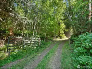 Entrance gate to lots. Photos are representative of the overall property and may not reflect the unique features of each individual lot.