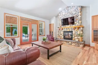The great room is just inside, with French doors that open up to the pool deck
