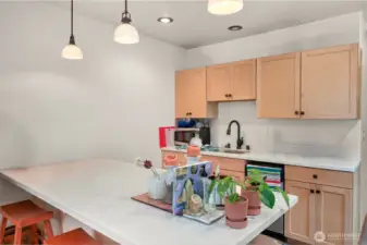 The ADU has a kitchenette with sink, dishwasher, and refrigerator. There is a 3/4 bathroom with a washer/dryer, and 1 bedroom in the unit.