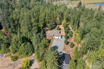 The pond is down the trail to the right and the trail makes a loop back behind the house.