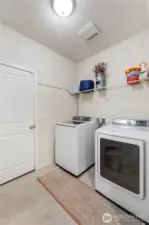 Laundry/Mud Room just off of the garage & kitchen. BONUS: Washer and Dryer can stay!