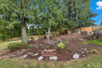 Woodsy outcropping, perfect for gardening and play.