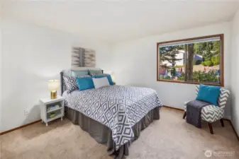 Guest bedroom with view of pool.