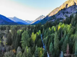 Modern photo looking north up the valley with subject property on the left of the road