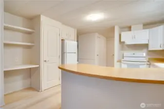 A brand-new refrigerator makes moving in easy, while adjustable LED lightbulbs in the fixture let you set the perfect mood.