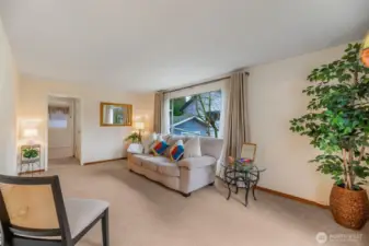 Front living with big picture window facing south fills the space with light.