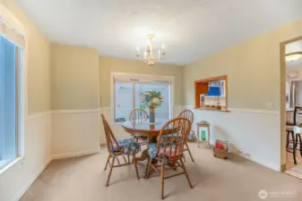 The dining room is light and bright and adjacent to the kitchen for ease and convenience.