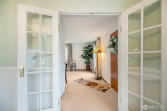 French doors lead to the living room from the dining room.