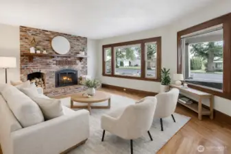 (Virtually Staged) Every home deserves a parlor room, and this one shines with a beautiful brick-surround fireplace, rich hardwood floors, and wide trim throughout. Enjoy Front St views, then close it in with the vintage pocket door for extra coziness.