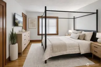 (Virtually Staged) The main floor features a spacious primary bedroom with an attached bath, offering comfort and convenience all on one level.