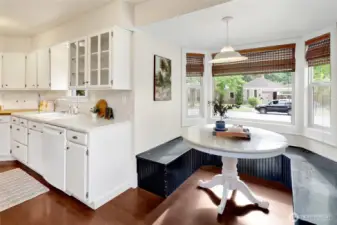 A charming breakfast nook offers the perfect spot to enjoy morning coffee or casual meals surrounded by natural light.