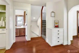 The stairwell leads to three upstairs bedrooms, one of which is really a spacious bonus room that offers plenty of flexibility for work, play, or guests if not used as a bedroom.