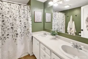 Conveniently located just off the kitchen, the main floor guest bath adds practicality and ease for everyday living.