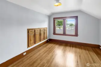 Bedroom #1 features more built-ins plus a walk-in-closet.