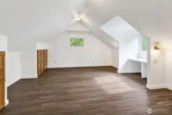 Bedroom #3 is spacious and features brand-new LVP flooring. If another bedroom isn't needed, it easily converts to a playroom, exercise space, storage area, or even a primary bedroom.