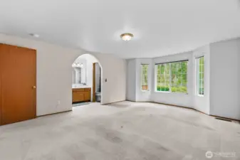Primary bedroom view into on-suite bath.