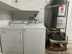 The washer and dryer are located in the large garage next to the hot water tank that was installed in 2020.