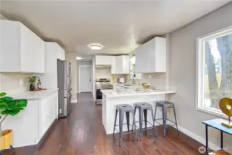 Beautiful brand new kitchen with hardwood flooring