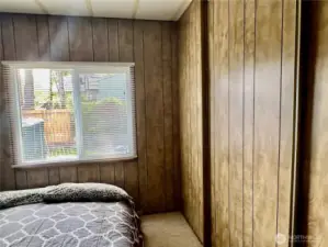 guest bedroom also has a wall of closets