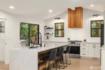 Updated, bright kitchen with oversized island for entertaining or eating.