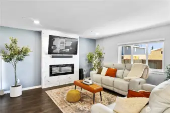 Open and inviting Living Room, electric fireplace and designer fireplace wall!