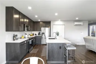 Tons of storage, a deep sink and lots of counterspace make cooking fun! Full Kitchen pantry too!