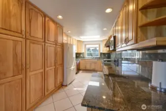 Updated kitchen with tile floors, Hickory Cabinetry and quartz counter tops. Lots of custom details.