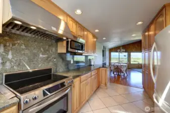 Updated kitchen with tile floors, Hickory Cabinetry and quartz counter tops. Lots of custom details.