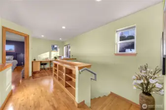 Upstairs holds 2 bedrooms a second full bath and office space. Filled with bright natural light from the 20 foot ceilings surrounding!