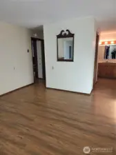 Primary Bedroom looking back toward entry door (which has closet behind it) and hallway into private bathroom and walk-in closet.
