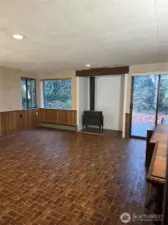 Bonus room Lower level with fireplace, massive open space and a sitting area and its own exit out the side of the house into the back yard.