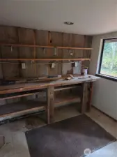 Hidden workshop located under the back deck and is part of the main house. but only accessable from exterior.