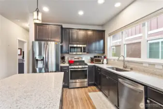 Lots of Windows over the sink make kitchen bright and inviting
