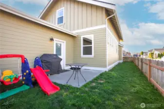 Corner lot with nice lawn and patio.